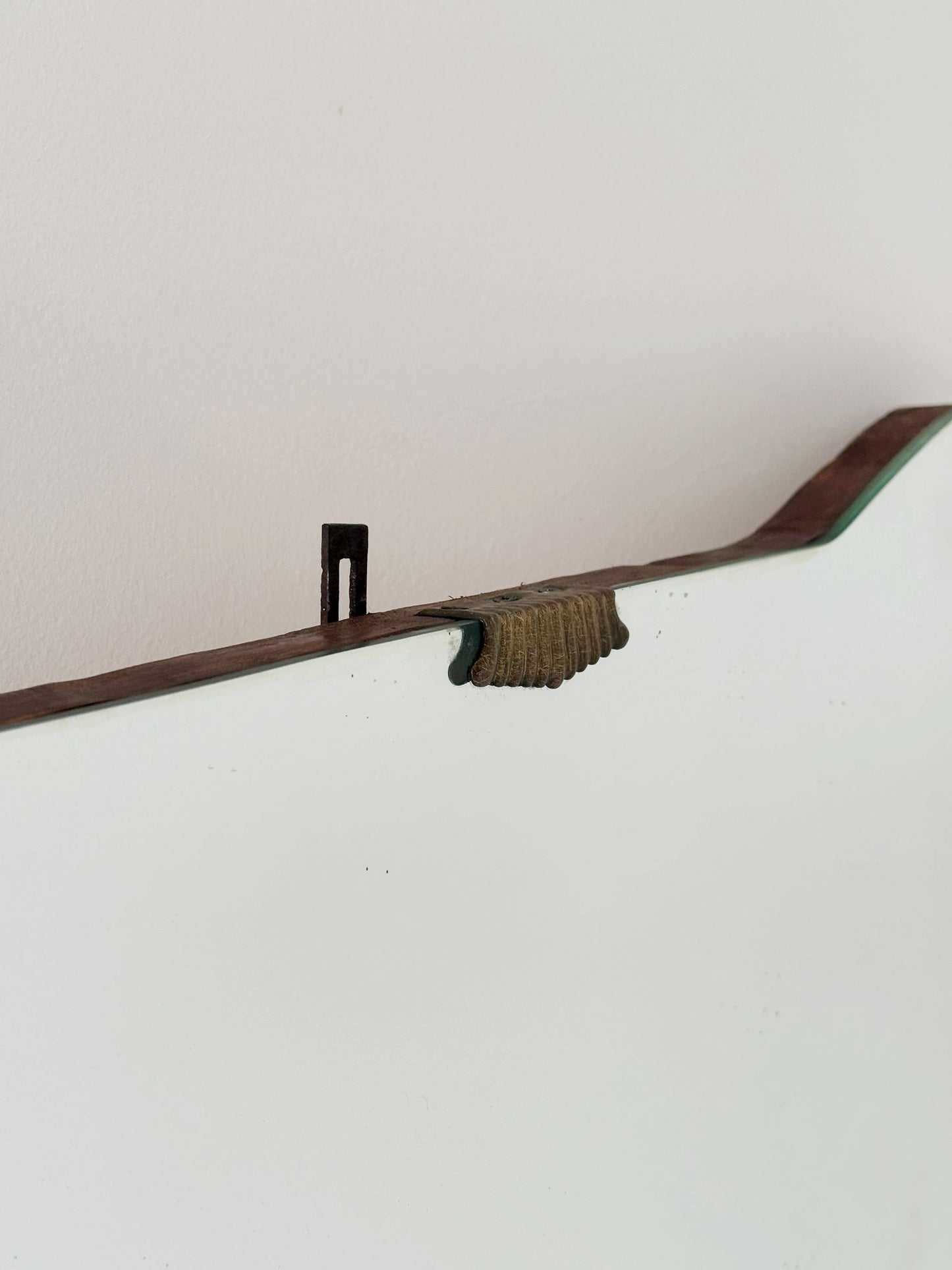 Shaped wall mirror with wooden edge