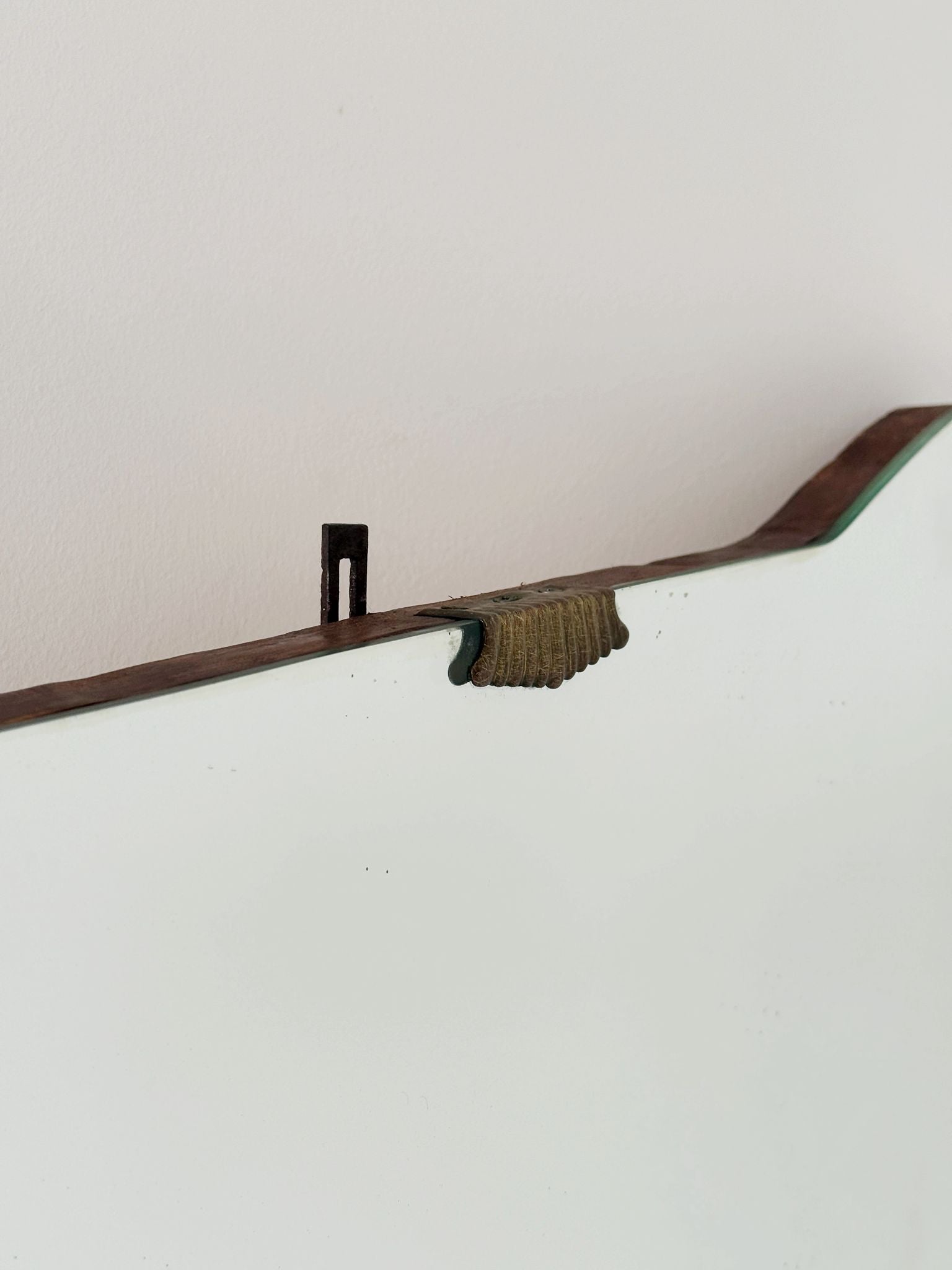 Shaped wall mirror with wooden edge