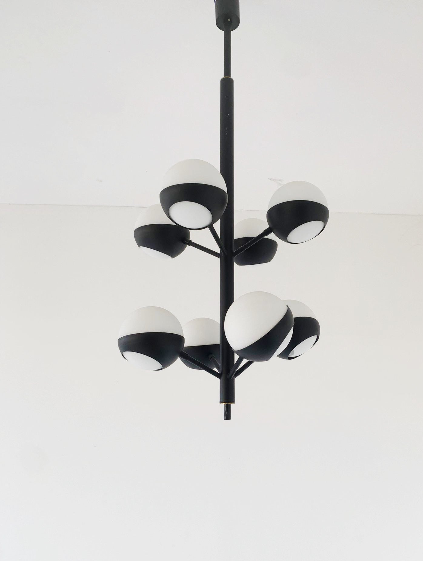 Black chandelier with glass spheres