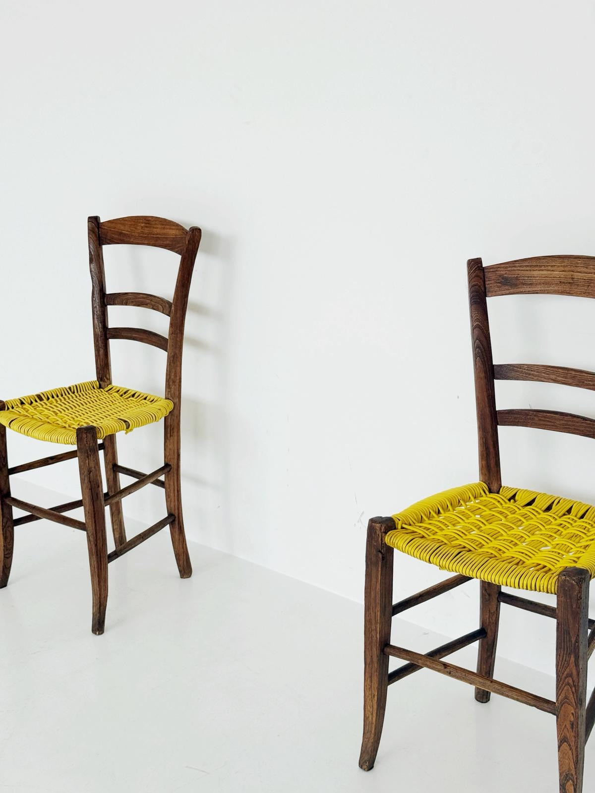 Pair of 1960s wooden chairs with yellow woven seat