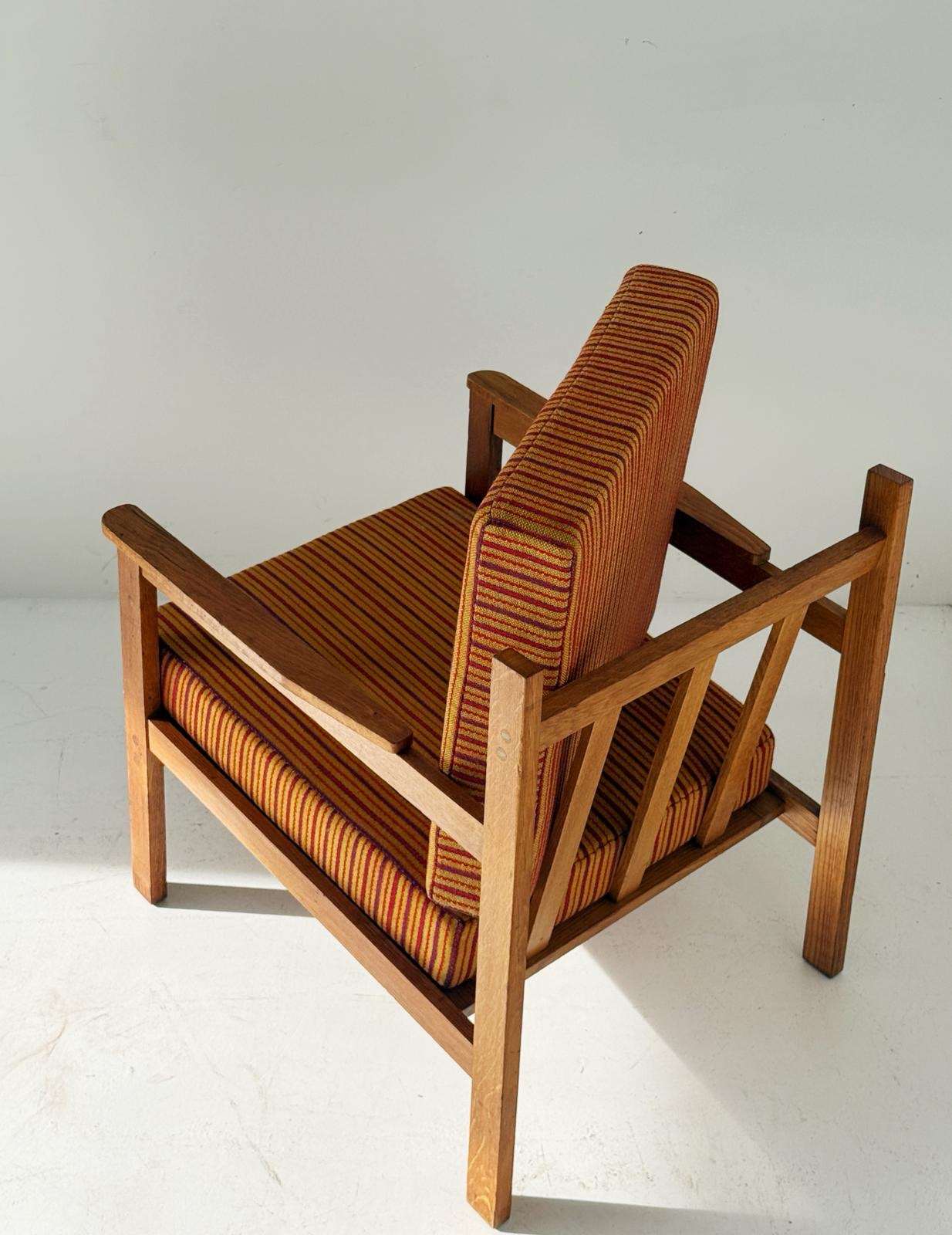 Solid wood armchair with striped upholstery
