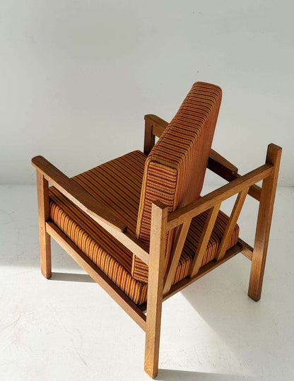 Solid wood armchair with striped upholstery