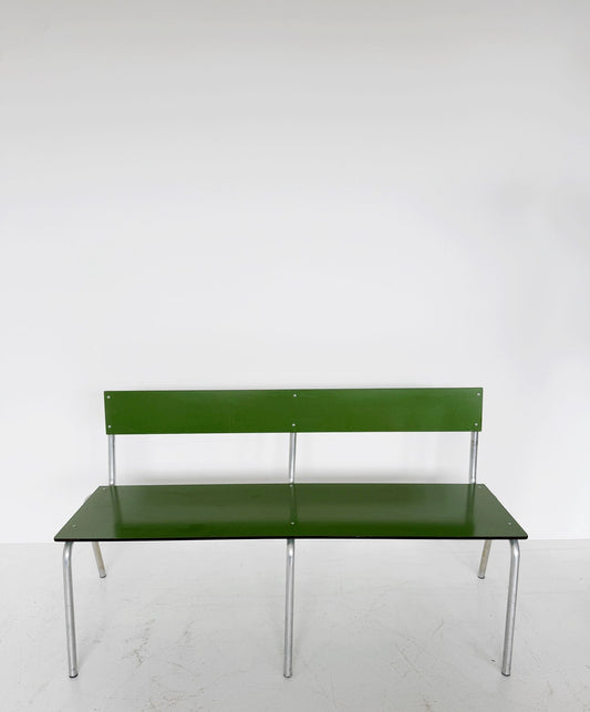 Green metal bench with tubular structure