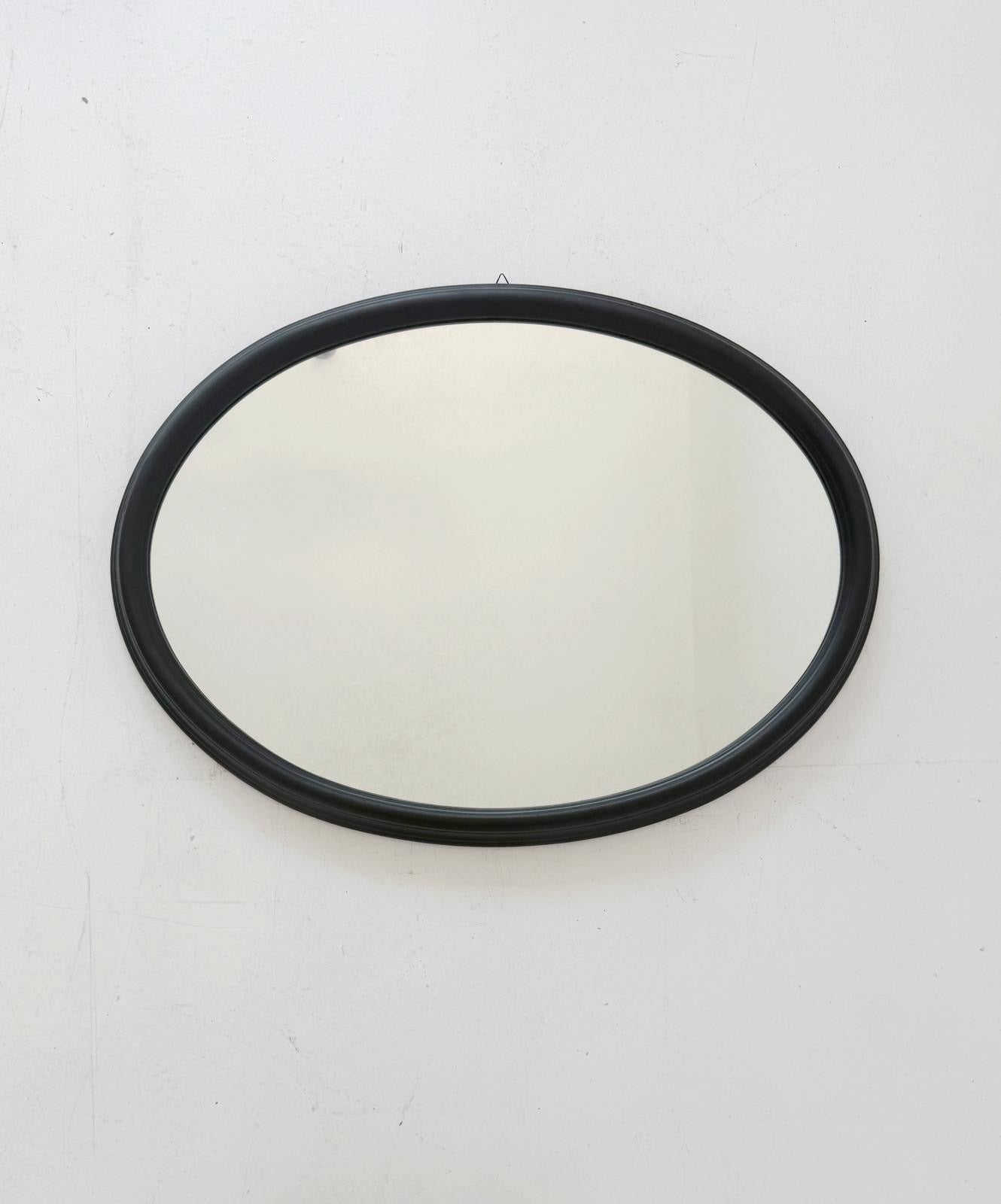 Oval wall mirror with wooden frame, 1960s